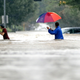 Moses Juarez, left, and Anselmo Padilla wade through floodwaters from Tropical Storm Harvey on Sunday, Aug. 27, 2017, in Houston, Texas. Image via the AP.